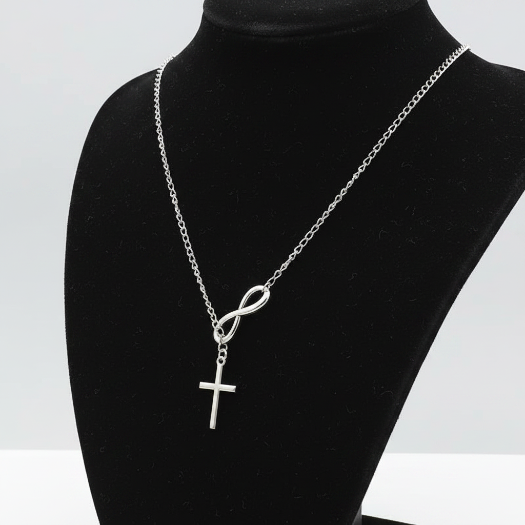 Silver infinity cross necklace side angle on black jewelry bust