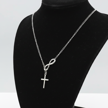Silver infinity cross necklace side angle on black jewelry bust