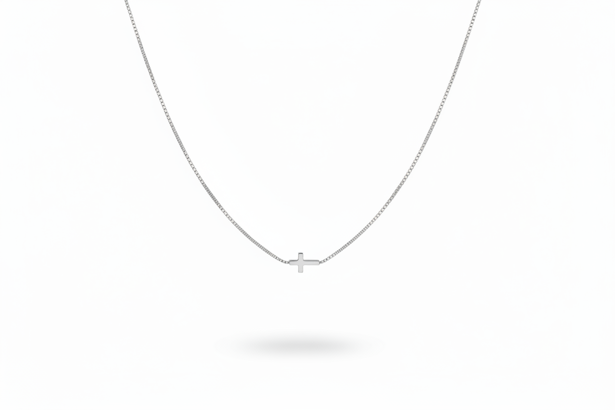 Silver Cross Necklace on White Background