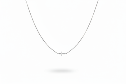 Silver Cross Necklace on White Background