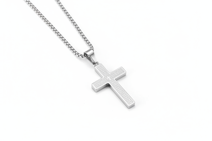 Silver cross necklace on white background